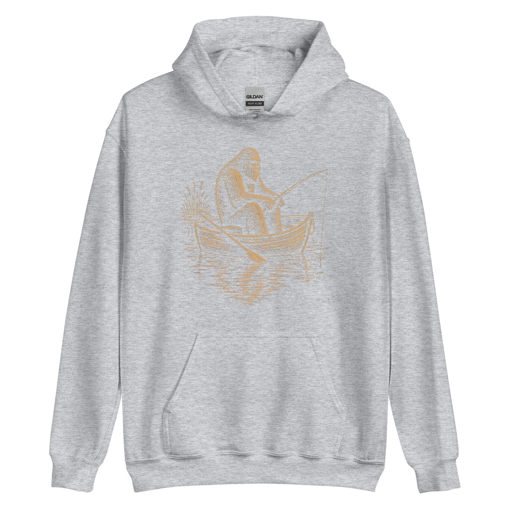 Vintage Bigfoot fishing hoodie featuring a peaceful Sasquatch in a rowboat. A cozy retro cryptid hoodie for anglers, campers and Bigfoot fans.