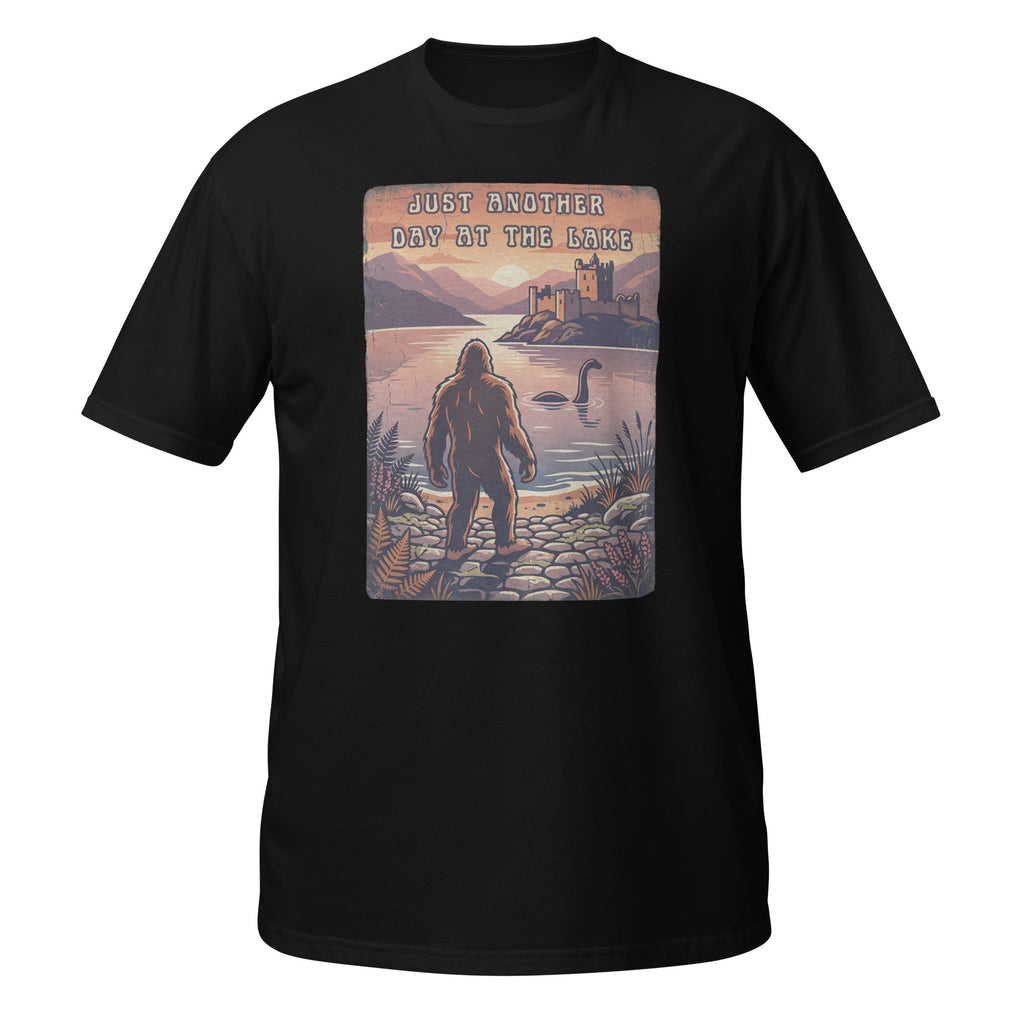 Bigfoot meets Loch Ness in this vintage-style graphic tee. “Just Another Day at the Lake” blends mystery, nature, and retro outdoor vibes 👀👣
