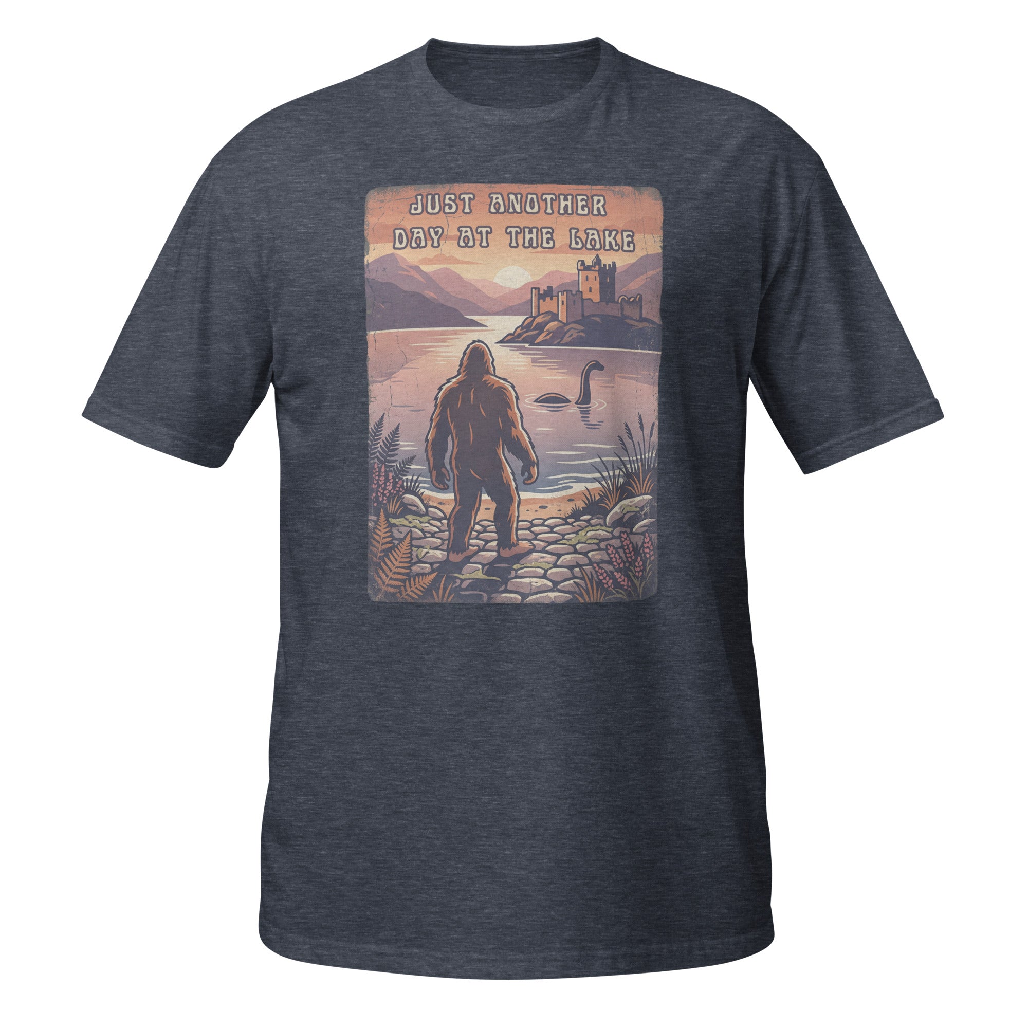 Bigfoot meets Loch Ness in this vintage-style graphic tee. “Just Another Day at the Lake” blends mystery, nature, and retro outdoor vibes 👀👣
