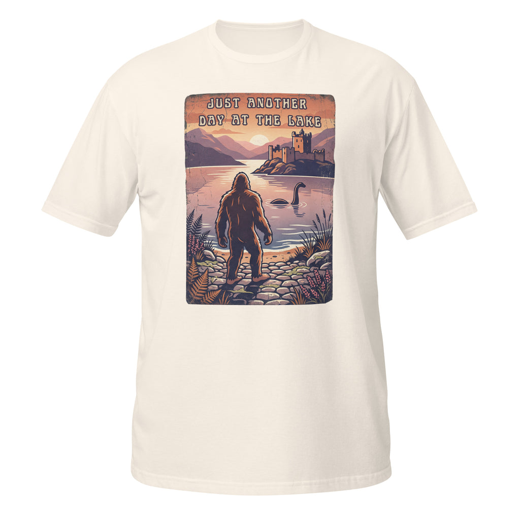 Bigfoot meets Loch Ness in this vintage-style graphic tee. “Just Another Day at the Lake” blends mystery, nature, and retro outdoor vibes 👀👣