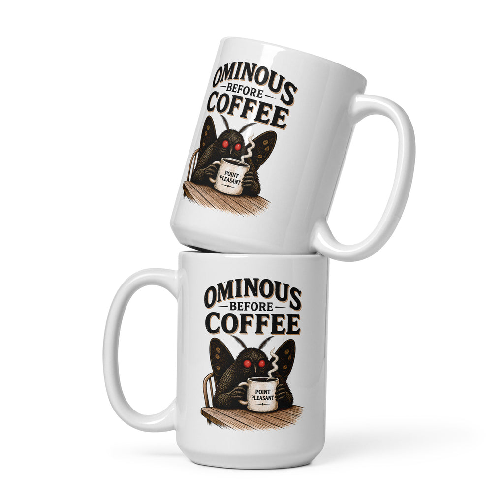 Vintage Mothman coffee mug featuring glowing red eyes and “Ominous Before Coffee” artwork. A funny cryptid gift for coffee lovers and folklore fans.