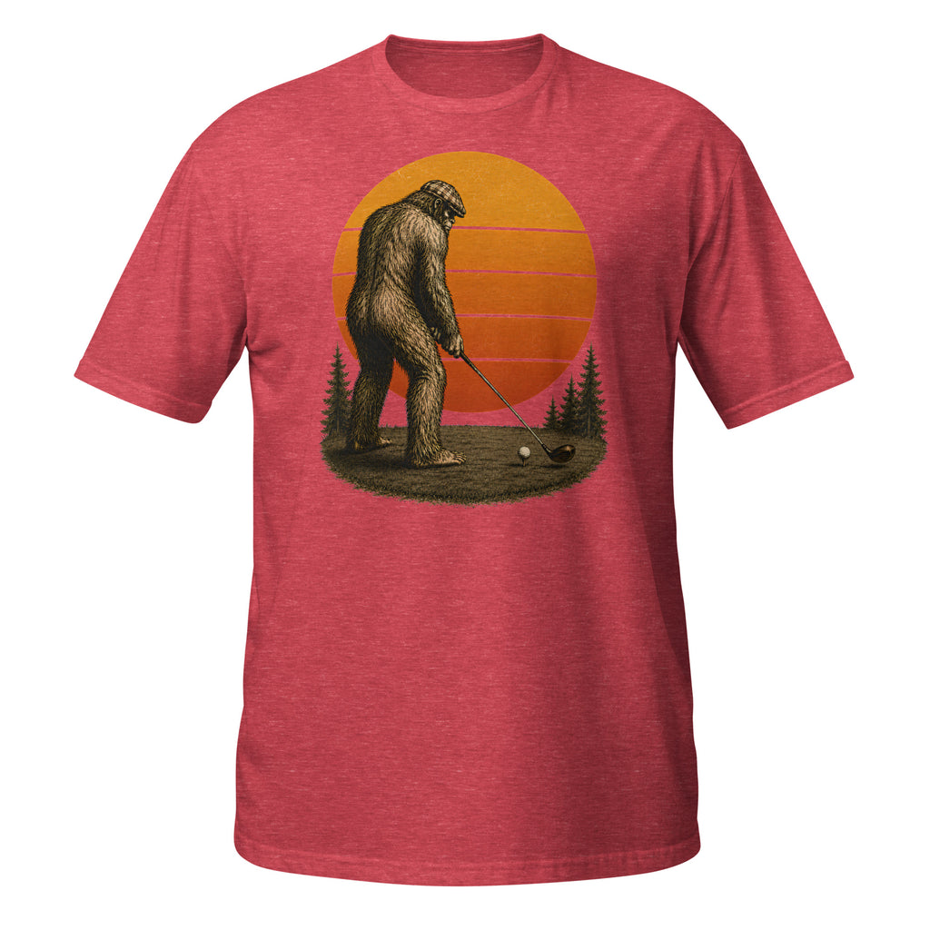 Vintage Bigfoot golfing graphic tee featuring Sasquatch lining up his drive beneath a retro sunset. A funny cryptid shirt for golfers and Bigfoot fans.