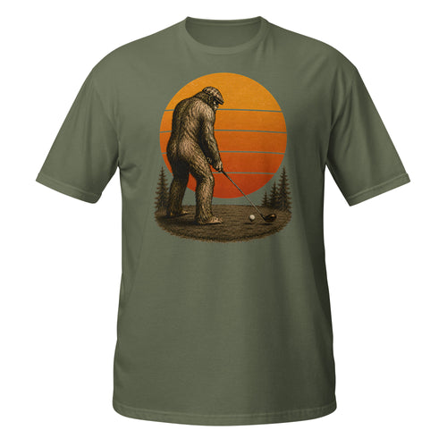 Vintage Bigfoot golfing graphic tee featuring Sasquatch lining up his drive beneath a retro sunset. A funny cryptid shirt for golfers and Bigfoot fans.
